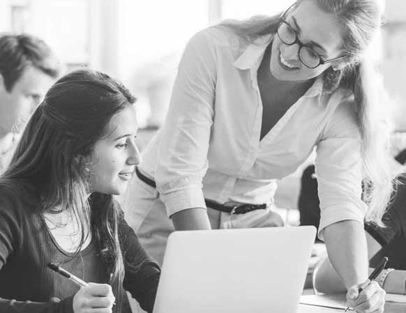 Teacher engaging with a student in class