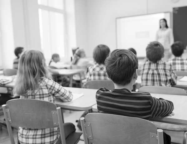 Children sitting in class attentively